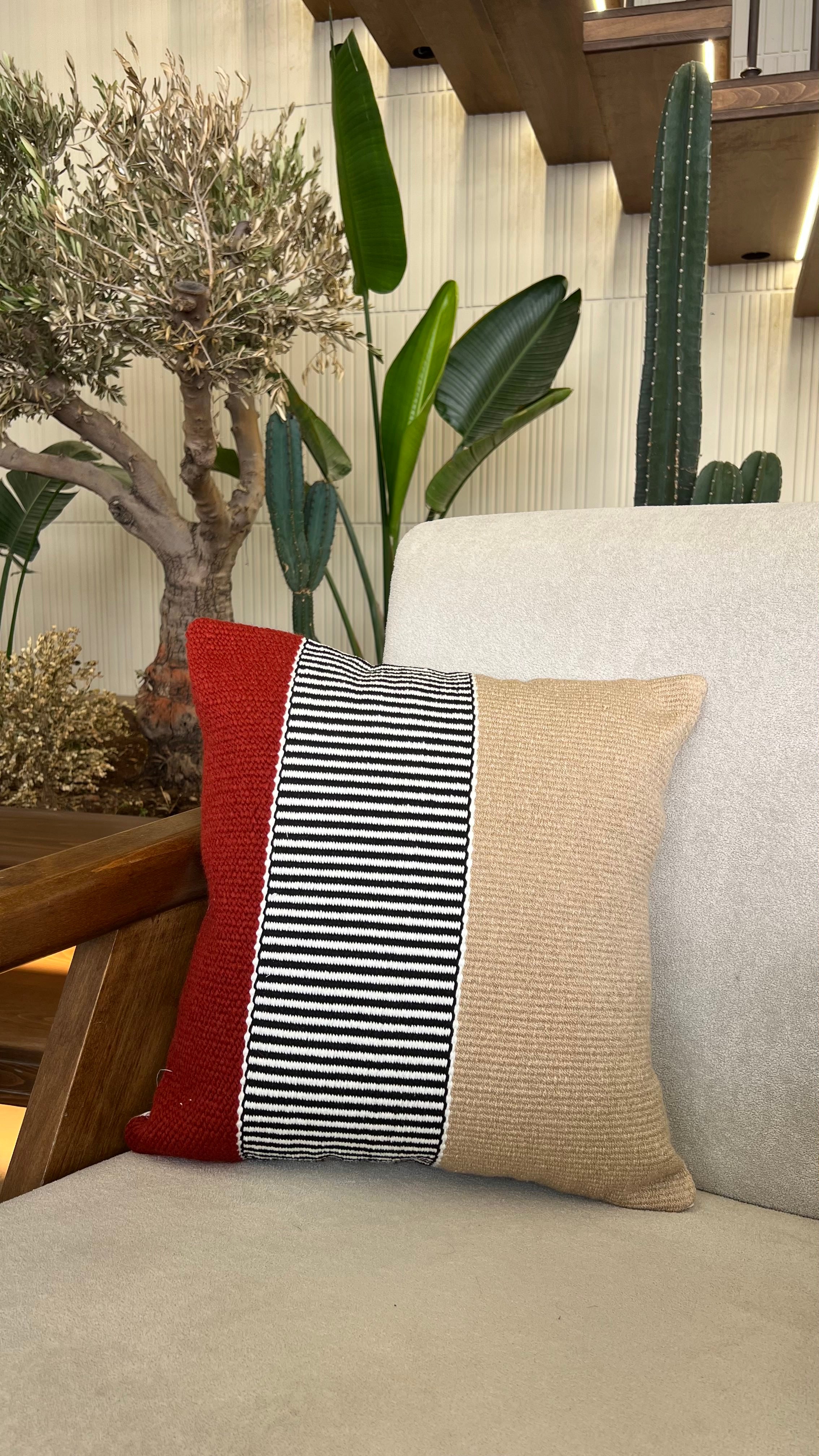 Hand weaved burgundy cushion