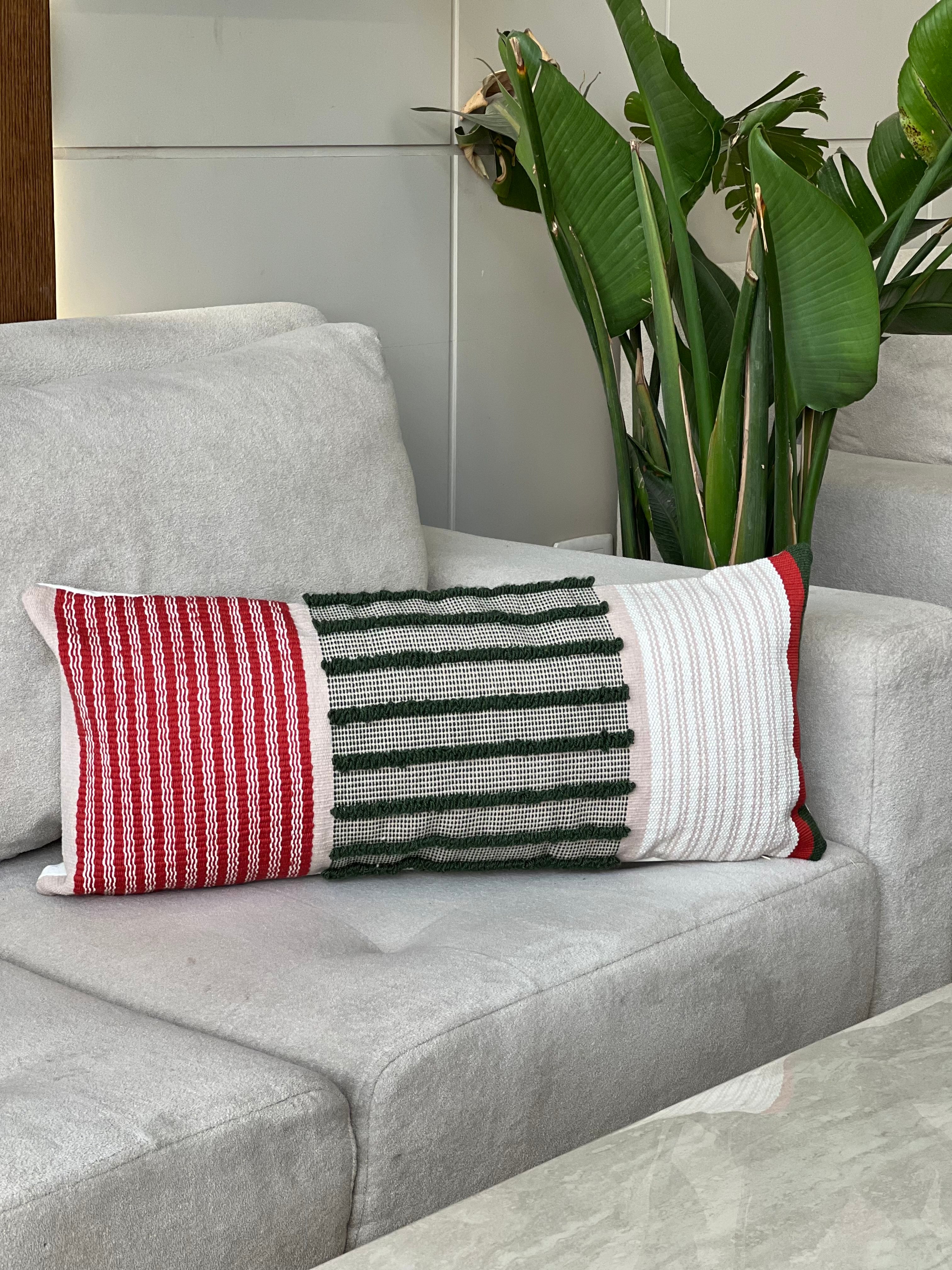 Handwoven green, red and off-white cushion