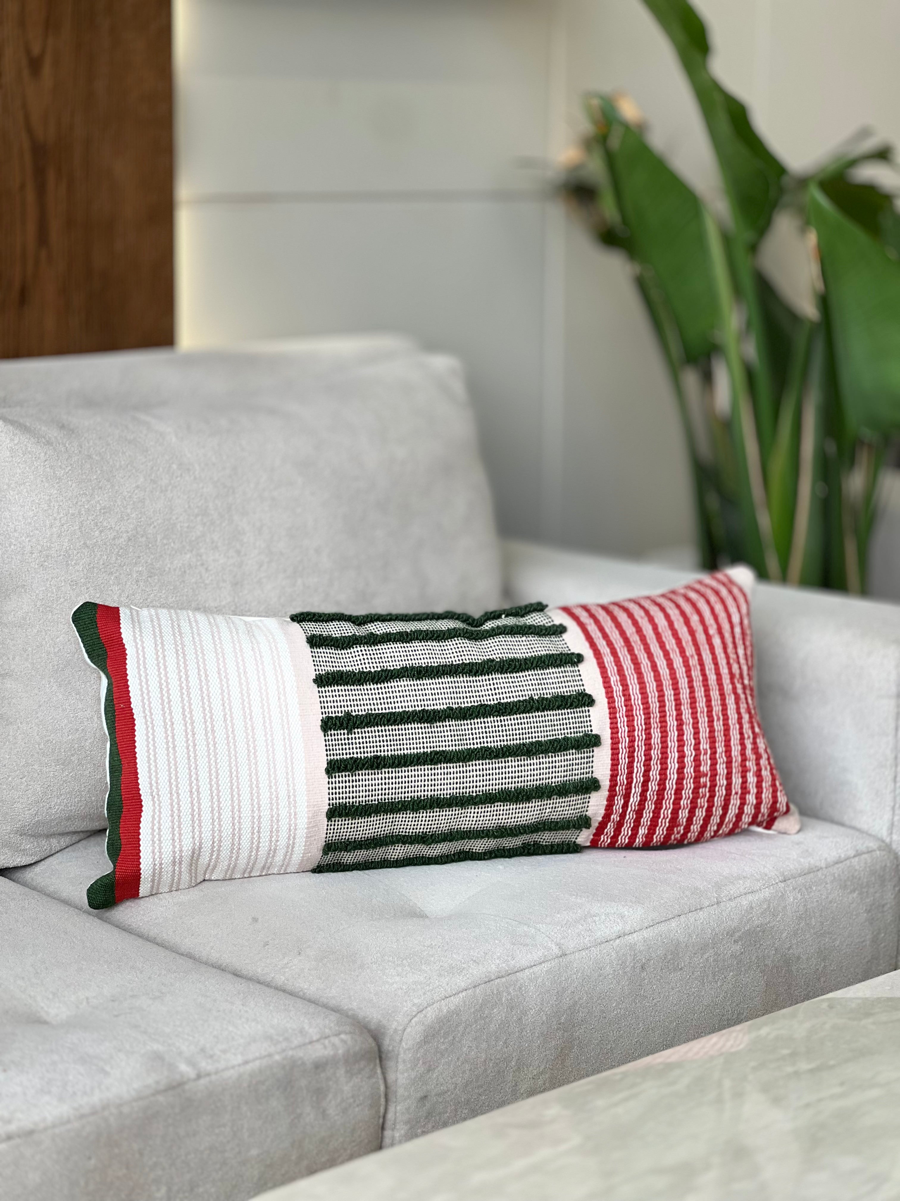 Handwoven green, red and off-white cushion